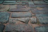 Дорога-насыпь через ров выложена плитами и материалами оставшимися при возведении храма.