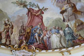 Фреска на потолке: французский король Людовик XIV даёт аудиенцию аббату Николаусу Вирету, справа — аллегорическая фигура науки Риторики, сидящей на мачте корабля.