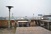 Вид из окна кафе  на набережную и пристань кораблика Стефани, курсирующего между берегами.