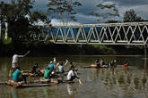 Аборигены сплавляются по реке Балием на самодельных плотах. Путь они держат из Восилимо. Там они набирают дров и привозят к себе в деревню. Еще по реке сплавляют лес, который заготавливают прямо на берегу перед этим мостом.