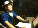 Один из лучших бурильщиков шахты, ударник Сергей Декалов за работой.