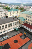 Вид на город с 8 этажа гостиницы Монблан. На переднем плане двор школы, которая знаменита тем, что в ней первой в Советском Союзе начали преподавать китайский язык.