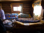 Вся остальная избушка, кроме небольшого пятачка перед печкой — практически одна большая многоспальная кровать.