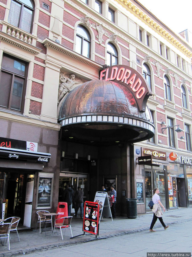 Вся Torggata – сплошные магазины и кафе, на фоне которых эффектно выделяется козырек кинотеатра Эльдорадо, существующего на этом месте под этим названием с 1929 г. и являющегося первым звуковым кинотеатром в Осло Осло, Норвегия